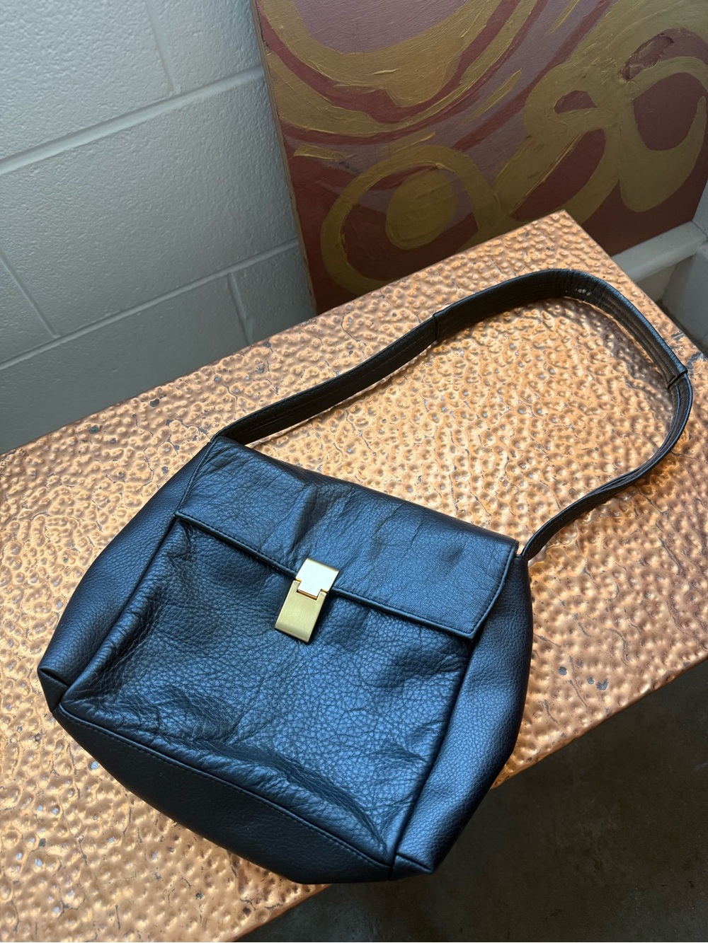 Elegant Black Leather Shoulder Bag with Gold Lock